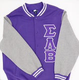 Purple/Gray Cotton Letterman has been discontinued by the manufacturer, pictured is sixe 2XL with 4" greek letters on the left side in purple over white 